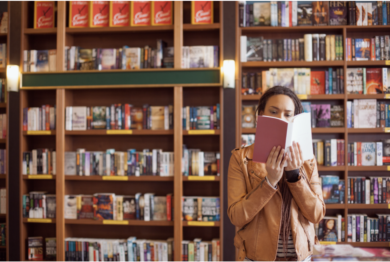 Person reading in a bookstore